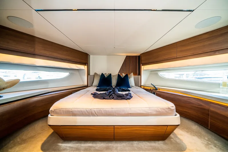 Record Year Yacht Photos Pics Luxurious bedroom interior of 2021 Princess Y85 Motor Yacht with modern design and elegant wood finishes.