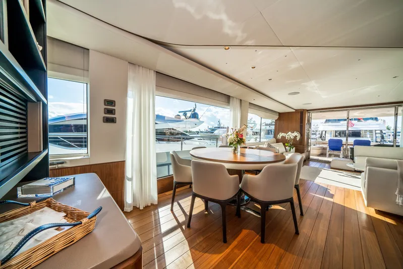 Record Year Yacht Photos Pics Luxurious interior of 2021 Princess Y85 Motor Yacht with elegant dining area and panoramic windows.