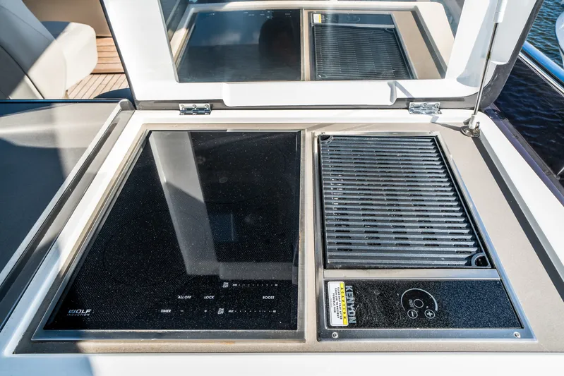 Record Year Yacht Photos Pics Outdoor kitchen on 2021 Princess Y85 Motor Yacht with induction cooktop and grill.