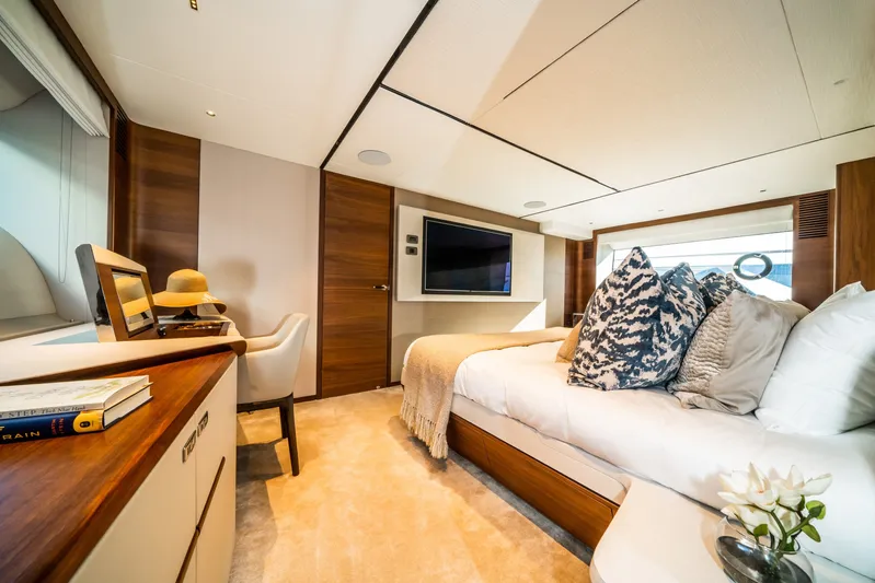 Record Year Yacht Photos Pics Luxurious bedroom interior of 2021 Princess Y85 Motor Yacht with elegant decor and modern amenities.