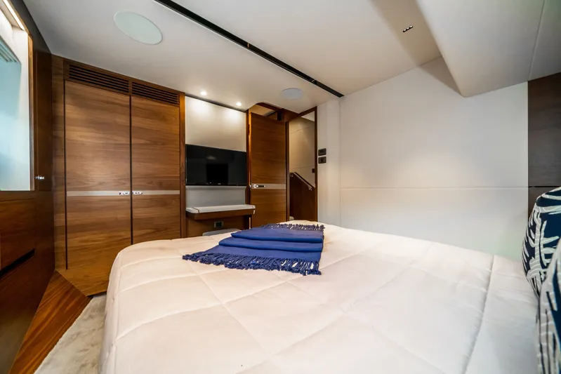 Record Year Yacht Photos Pics Luxurious bedroom interior of 2021 Princess Y85 Motor Yacht with modern wood finishes.