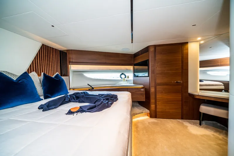 Record Year Yacht Photos Pics Luxurious bedroom interior of 2021 Princess Y85 Motor Yacht with elegant wood finishes.