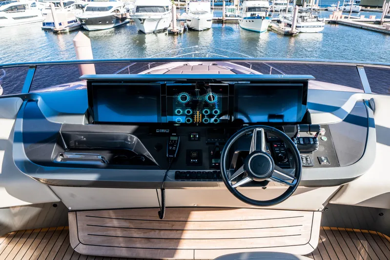 Record Year Yacht Photos Pics Helm of 2021 Princess Y85 Motor Yacht with modern controls and marina view.