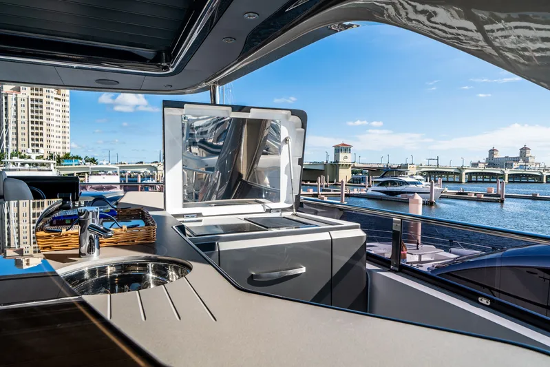 Record Year Yacht Photos Pics Luxurious 2021 Princess Y85 Motor Yacht with sleek outdoor kitchen and stunning marina view.