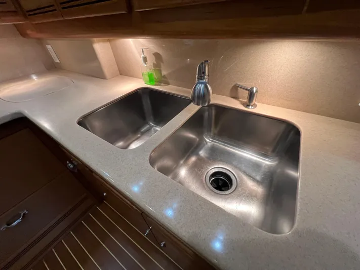 Pacific Adventures Yacht Photos Pics 2008 Cabo 52 Express kitchen with dual stainless steel sinks and modern fixtures.