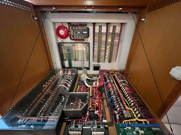 Pacific Adventures Yacht Photos Pics Electrical panel inside 2008 Cabo 52 Express boat, showcasing wiring and components.