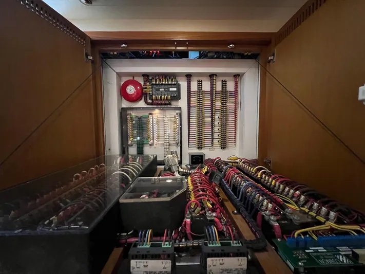 Pacific Adventures Yacht Photos Pics Electrical panel inside 2008 Cabo 52 Express boat, showcasing wiring and components.