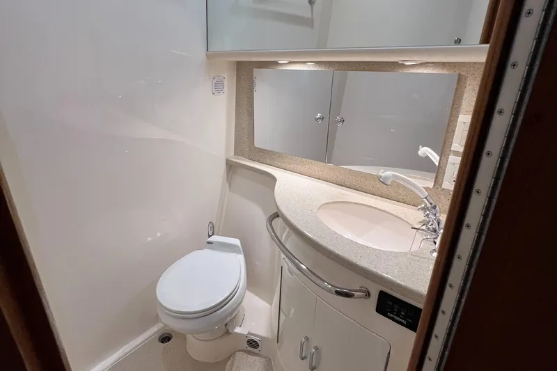 Pacific Adventures Yacht Photos Pics 2008 Cabo 52 Express yacht bathroom with modern fixtures and sleek design.