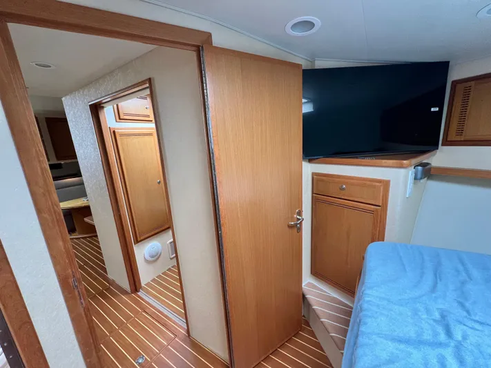 Pacific Adventures Yacht Photos Pics Interior of 2008 Cabo 52 Express yacht with wood paneling and modern amenities.