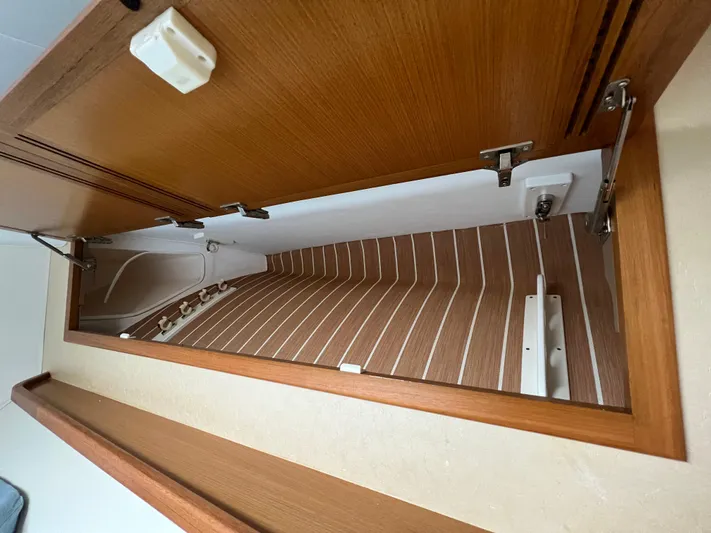 Pacific Adventures Yacht Photos Pics Interior view of 2008 Cabo 52 Express yacht with wooden cabinetry.