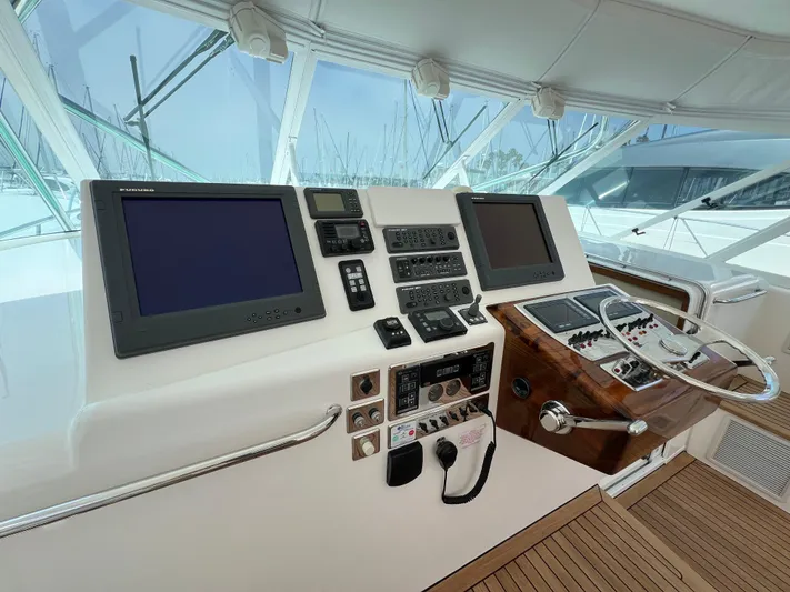 Pacific Adventures Yacht Photos Pics 2008 Cabo 52 Express helm with navigation screens and controls.