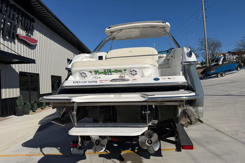  Yacht Photos Pics 2019 Cobalt R35 boat at a marina, rear view with propellers visible.