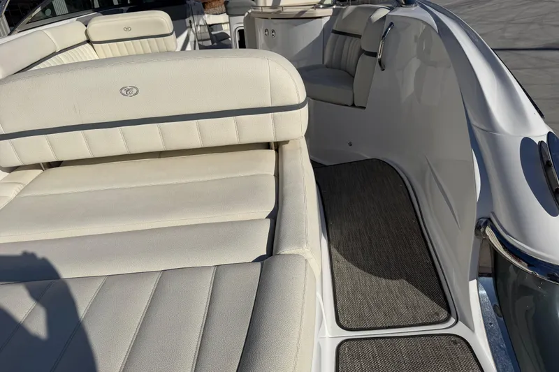  Yacht Photos Pics 2019 Cobalt R35 boat interior with white cushioned seating and gray flooring.