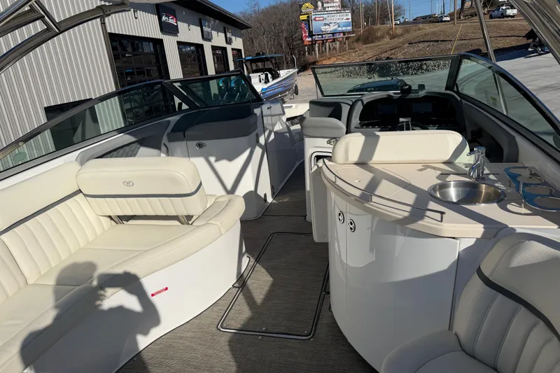  Yacht Photos Pics Interior of a 2019 Cobalt R35 boat with seating and a small sink.