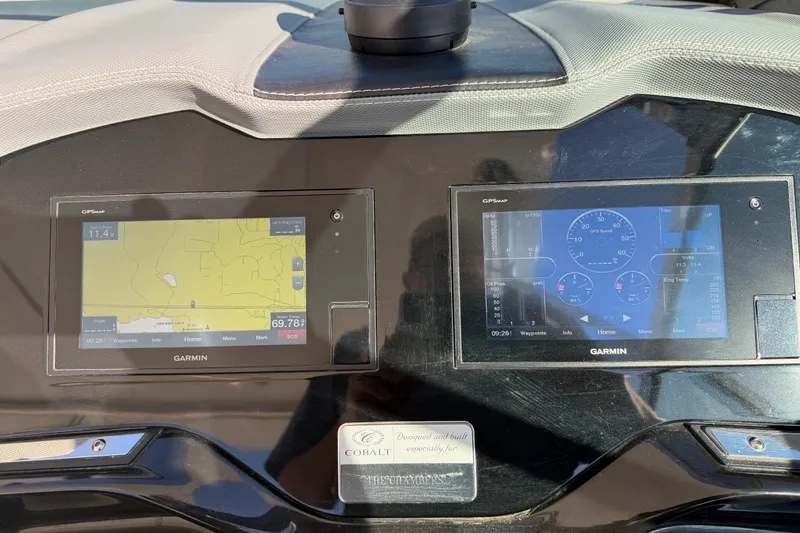  Yacht Photos Pics Dashboard of a 2019 Cobalt R35 with dual Garmin displays showing navigation and engine data.