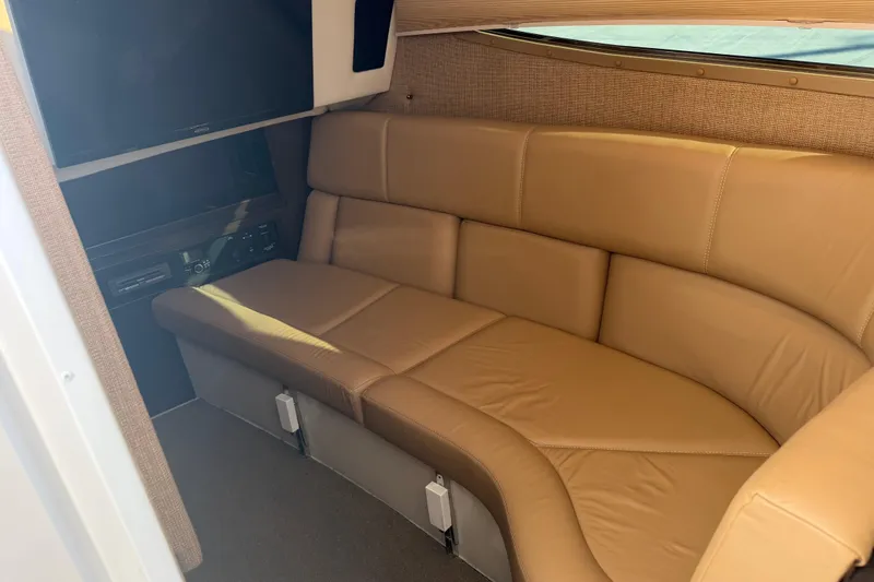  Yacht Photos Pics Luxurious interior of 2019 Cobalt R35 with tan leather seating and entertainment system.