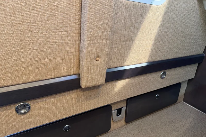  Yacht Photos Pics 2019 Cobalt R35 interior with beige upholstery and storage compartments.
