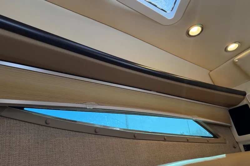  Yacht Photos Pics Interior view of 2019 Cobalt R35 boat with window and ceiling lights.