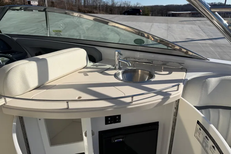  Yacht Photos Pics 2019 Cobalt R35 boat interior with sink and seating area.