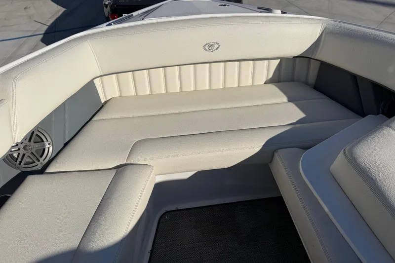  Yacht Photos Pics 2019 Cobalt R35 boat interior with white cushioned seating and speaker.