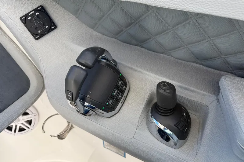  Yacht Photos Pics 2019 Cobalt R35 boat controls with joystick and throttle on gray panel.
