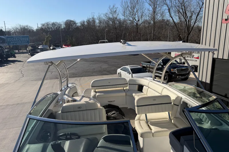  Yacht Photos Pics 2019 Cobalt R35 boat with spacious seating and sleek design in a parking lot.