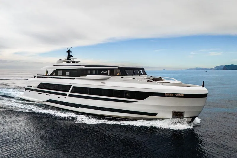 L.a.u.l Yacht Photos Pics Luxurious 2019 ISA Extra 130 yacht cruising on open sea under cloudy sky.