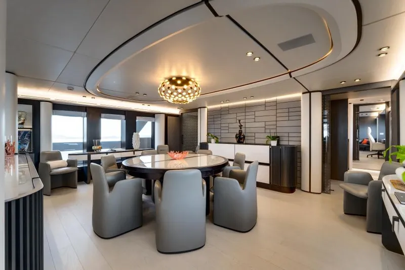 L.a.u.l Yacht Photos Pics Luxurious dining area in 2019 ISA Extra 130 yacht, featuring modern decor and elegant lighting.
