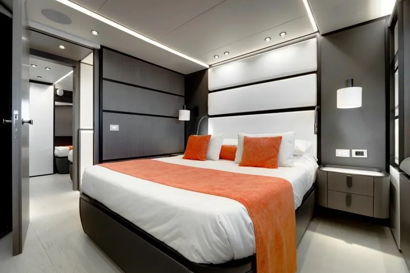 L.a.u.l Yacht Photos Pics Luxurious bedroom interior on 2019 ISA Extra 130 yacht with modern design and orange accents.