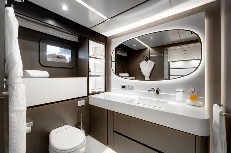 L.a.u.l Yacht Photos Pics Luxurious yacht bathroom with modern fixtures, large mirror, and elegant lighting, ISA Extra 130, 2019.