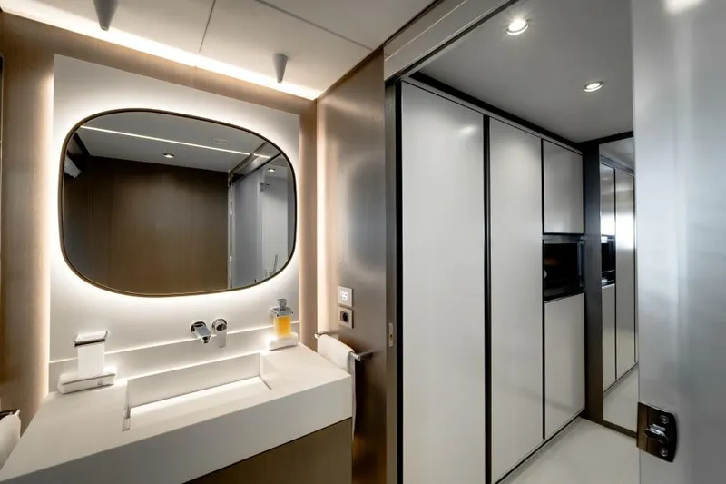 L.a.u.l Yacht Photos Pics Luxurious bathroom interior on 2019 ISA Extra 130 yacht, featuring modern sink and mirror.