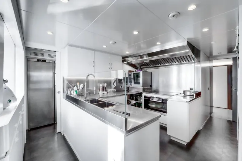 L.a.u.l Yacht Photos Pics Modern yacht kitchen with stainless steel appliances, sleek design, and ample workspace, ISA Extra 130, 2019.
