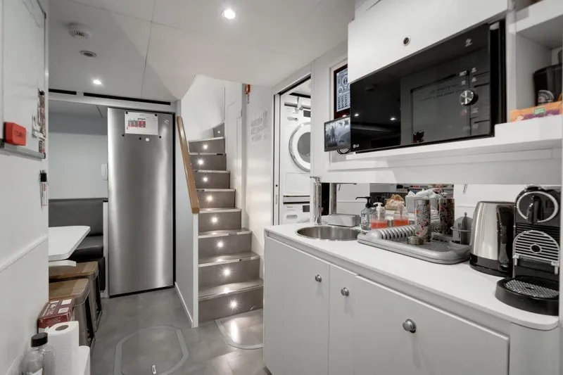 L.a.u.l Yacht Photos Pics Modern yacht interior with kitchenette, stairs, and appliances in 2019 ISA Extra 130 model.