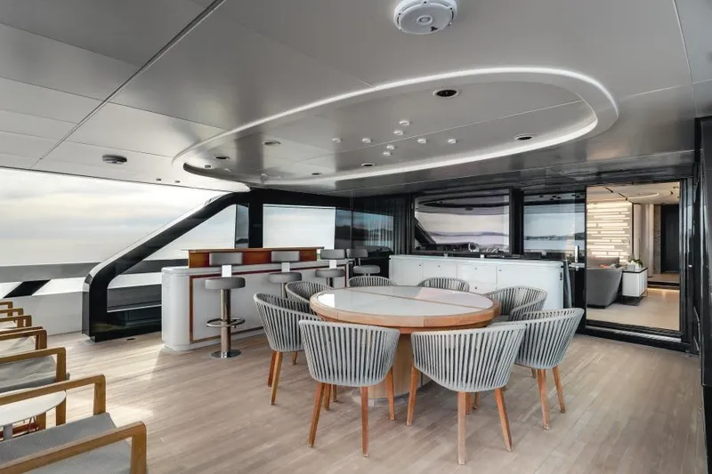 L.a.u.l Yacht Photos Pics Luxurious 2019 ISA Extra 130 yacht deck with modern dining area and bar.