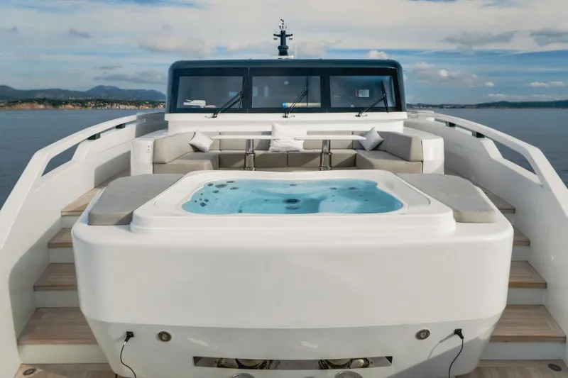 L.a.u.l Yacht Photos Pics Luxurious 2019 ISA Extra 130 yacht with jacuzzi and seating area on deck.