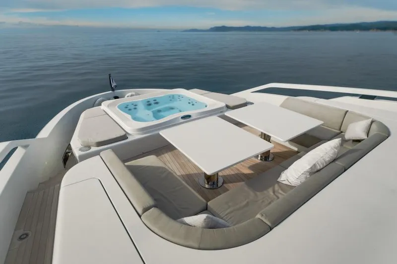 L.a.u.l Yacht Photos Pics Luxurious 2019 ISA Extra 130 yacht deck with jacuzzi and seating area.