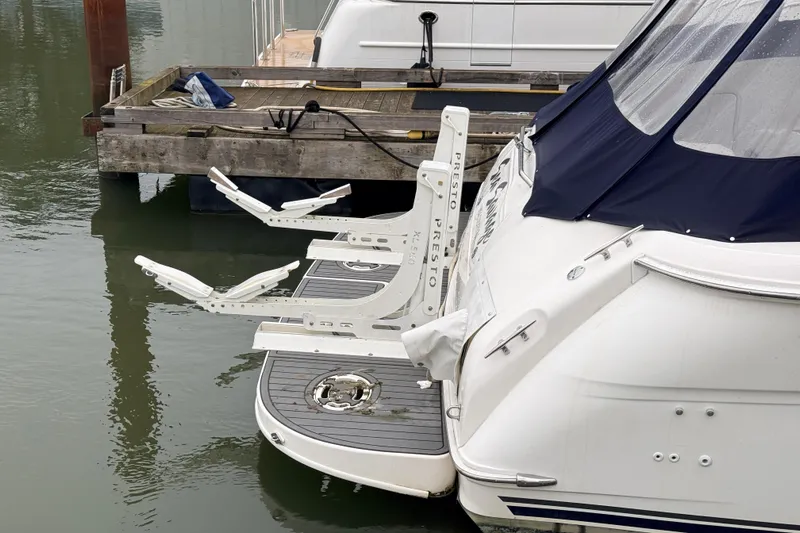 Sea Savage Yacht Photos Pics 2000 Sea Ray 480 Sedan Bridge with Presto lift at dockside.