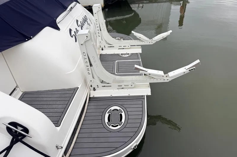 Sea Savage Yacht Photos Pics Rear view of a 2000 Sea Ray 480 Sedan Bridge with swim platform and davit system.