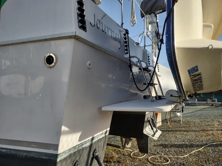 Journey Yacht Photos Pics 2002 Endeavour Trawlercat 36 docked, showing stern details and equipment.