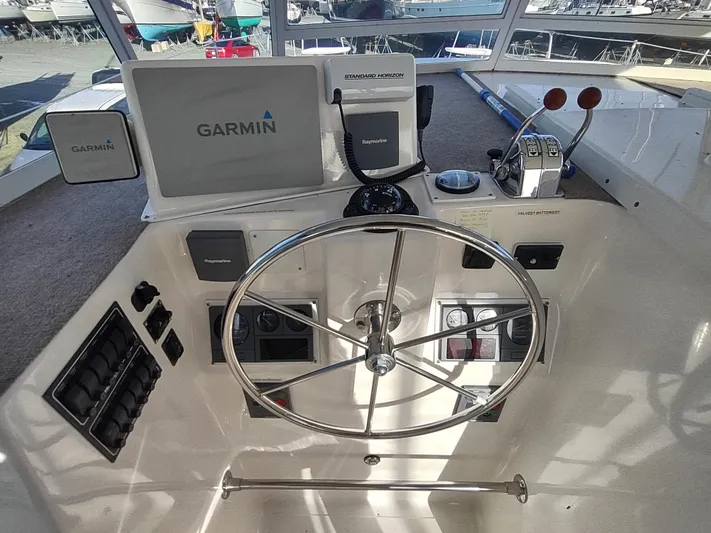 Journey Yacht Photos Pics Helm of 2002 Endeavour Trawlercat 36 with Garmin navigation system.