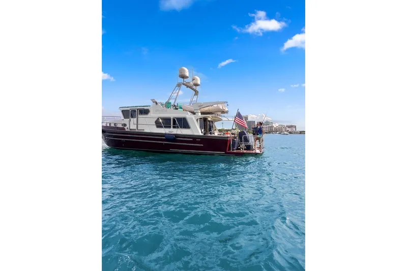 Oberwolf Yacht Photos Pics 2009 EagleCraft 47' Pilothouse boat on blue water under clear sky.