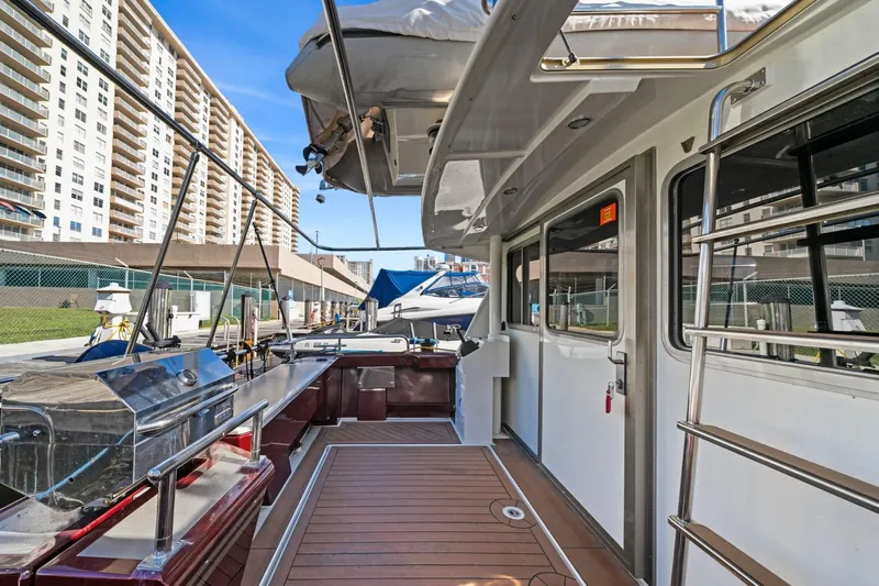 Oberwolf Yacht Photos Pics 2009 EagleCraft 47' Pilothouse yacht docked, featuring spacious deck and modern amenities.