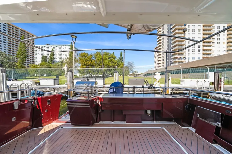 Oberwolf Yacht Photos Pics EagleCraft 47' Pilothouse 2009 yacht interior with wooden deck and marina view.