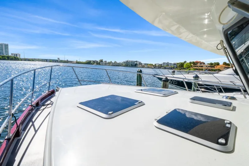 Oberwolf Yacht Photos Pics 2009 EagleCraft 47' Pilothouse yacht on serene water with clear blue sky.