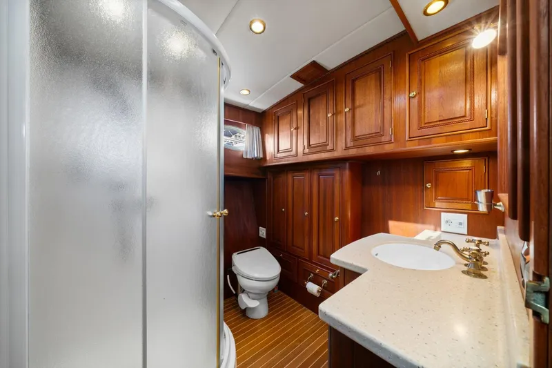 Oberwolf Yacht Photos Pics Luxurious bathroom in 2009 EagleCraft 47' Pilothouse with wood cabinetry and modern fixtures.