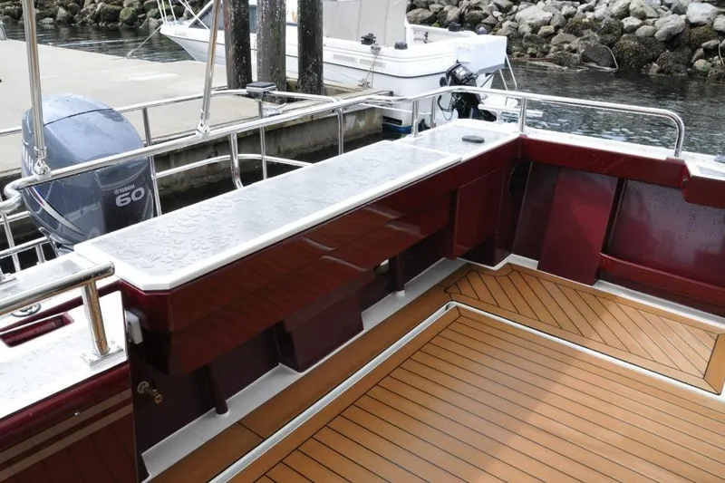 Oberwolf Yacht Photos Pics EagleCraft 47' Pilothouse 2009 boat deck with Yamaha 60 engine at dock.