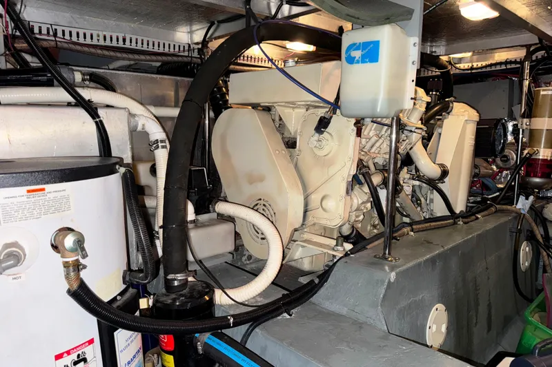  Yacht Photos Pics Engine room of 1997 Carver 445 Aft Cabin Motor Yacht, showcasing mechanical components.