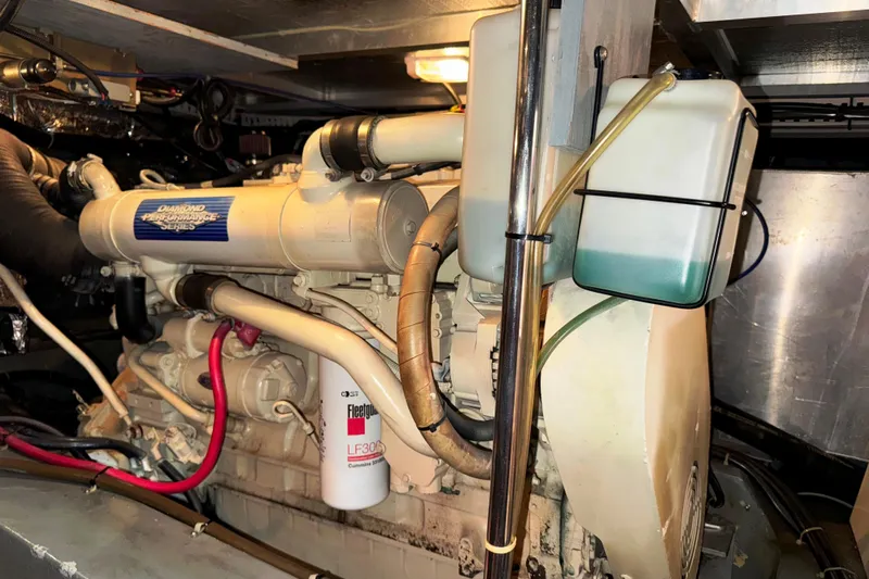  Yacht Photos Pics Engine room of 1997 Carver 445 Aft Cabin Motor Yacht, featuring a Cummins engine.