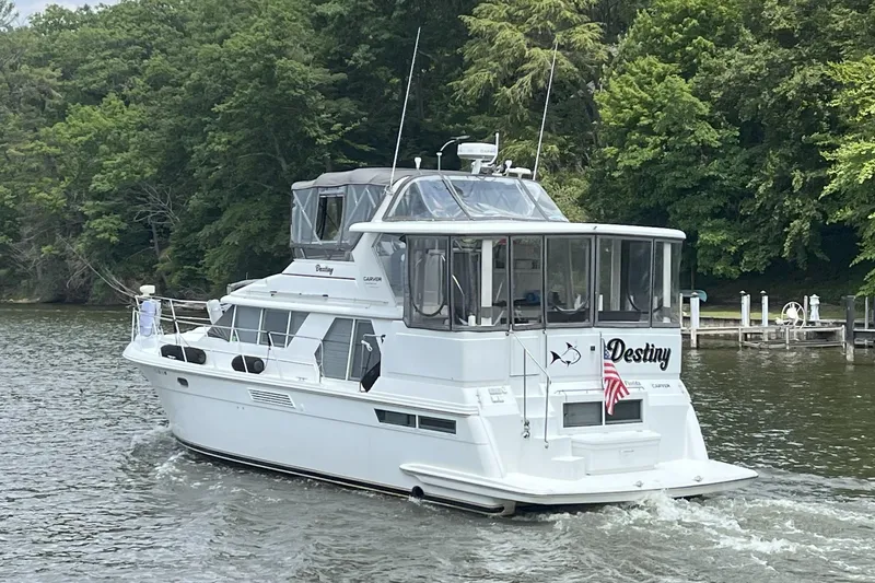 Yacht Photos Pics 1997 Carver 445 Aft Cabin Motor Yacht "Destiny" cruising on a scenic river.