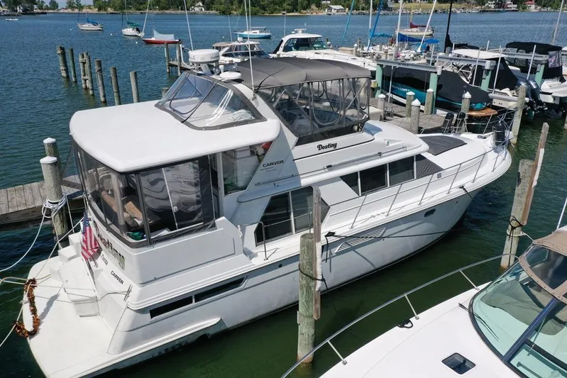  Yacht Photos Pics 1997 Carver 445 Aft Cabin Motor Yacht docked at marina, aerial view.